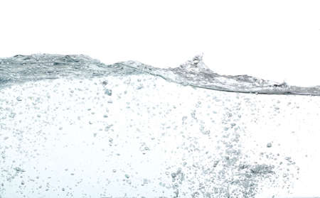 Waves of water with lots of bubbles, over whiteの写真素材