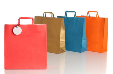 Assorted colored shopping bags over white backgroundの写真素材