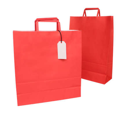 Two red paper shopping bags over whiteの写真素材