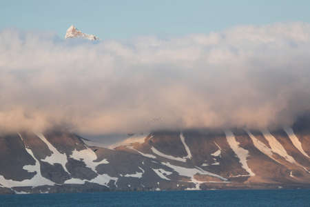 Mountain landscape - summit over the cloudsの写真素材