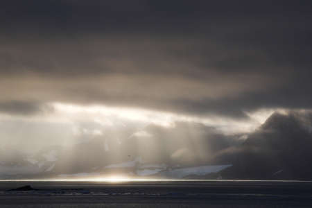 Mountain landscape - sun rays on the sea
