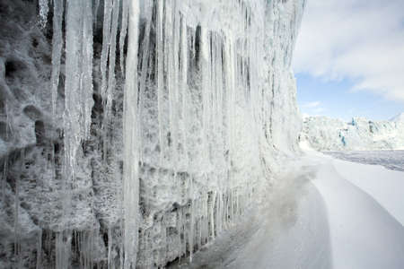 Icicles on the wall of the Arctic glacier