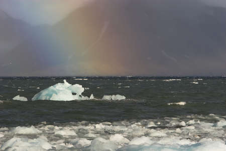 Rainbow over the fjordの写真素材