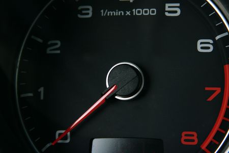 Car tachometer with red arrow