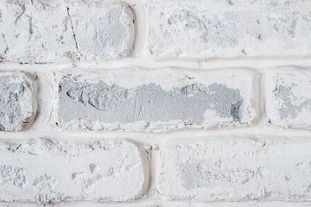 Abstract horizontal white background of a shabby brick wall.の写真素材