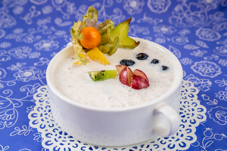 Yoghurt with berries in a white bowlの写真素材