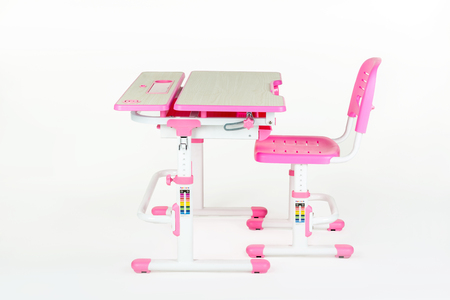 pink school desk is isolated on a white backgroundの写真素材