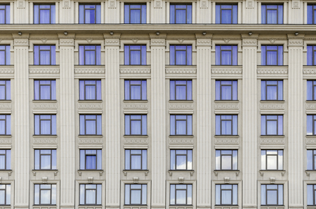 wall of a building with blue windowsの写真素材