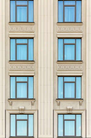 wall of a building with blue windowsの写真素材