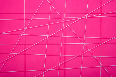 texture of a pink abstract wall with white geometric linesの写真素材