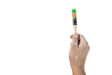 hand with a brush on white isolated backgroundの写真素材