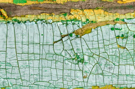 textured green-yellow peeling paintの写真素材