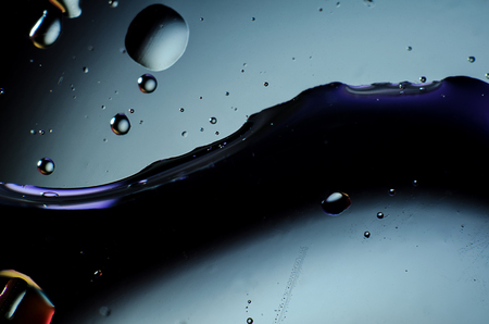 Abstract background of colorful drops and drops of water or oil on the whole frameの写真素材