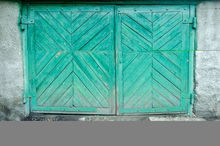 old green wooden gateの写真素材