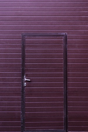 burgundy metal door on the whole frameの写真素材