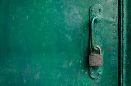 Old peeling green wooden doorの写真素材