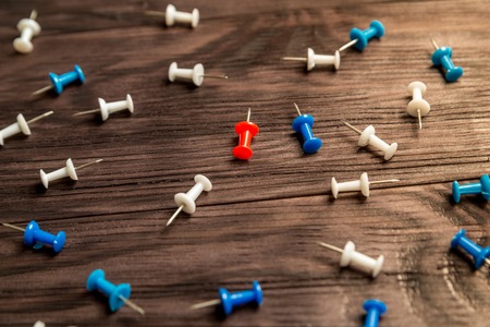 multicolored buttons on brown wooden backgroundの写真素材