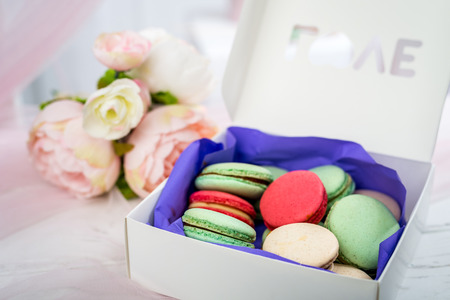 Delicious multicolored small macaroons in a box. Horizontal frameの写真素材
