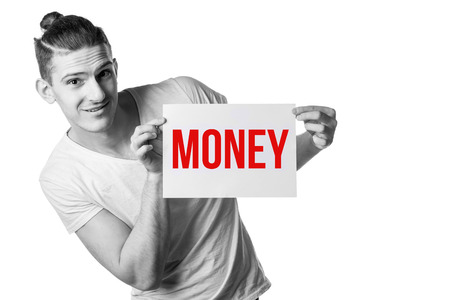 A young handsome guy with a blank sheet of paper looking at a sheet. Place for signature, text