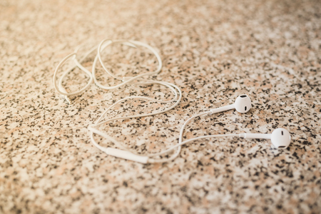 White vacuum headphones on a granite backgroundの写真素材