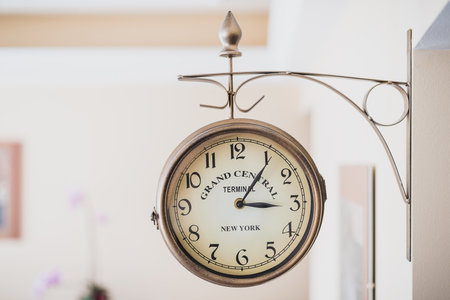 Round wall clock is attached to the wallのeditorial素材