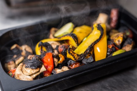 grilled paprika, mushrooms, tomatoes and eggplants lie on the whole frameの写真素材