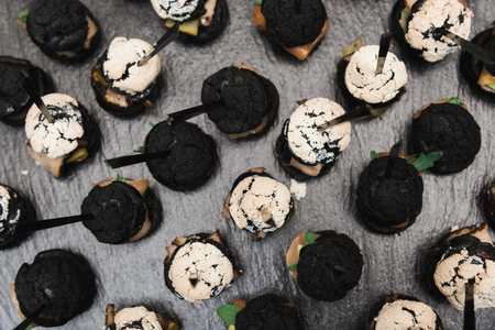 Small burgers served on one plate as appetizers. Horizontal frameの写真素材