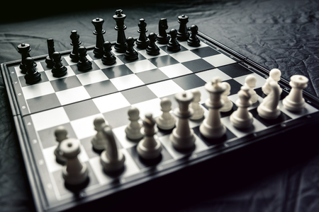 Chess board with black and white chess facing each other. Horizontal frameの写真素材