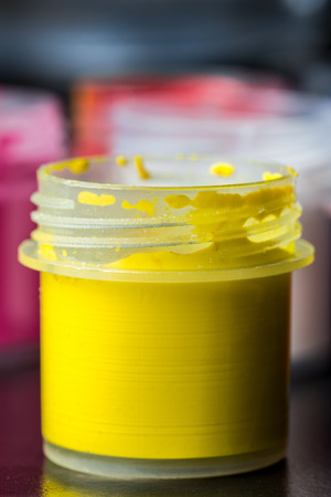 Bank of yellow gouache on the whole frame. Vertical frameの写真素材