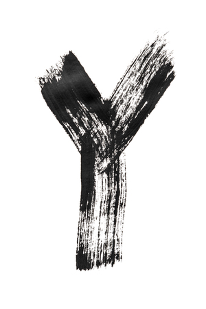 The English alphabet, the letter "Y" is written in black paint on a white isolated background. Vertical frameの写真素材