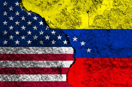 Flag of Venezuela and USA on the background texture of the shabby paint with a crack on the whole frame. Horizontal frameの写真素材