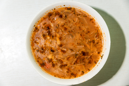 Ukrainian national dish, borsch in a white plate. Horizontal frameの写真素材