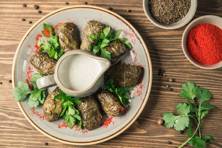 Traditional Georgian and Armenian cuisine. The dish "Dolma". Cabbage rolls of grape leaves with rice and minced meat. Copy space, selective focus. Horizontal frameの写真素材
