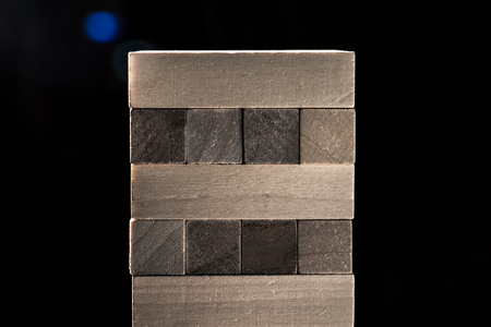 multistory tower of wooden blocks. jenga game. Horizontal frameの写真素材
