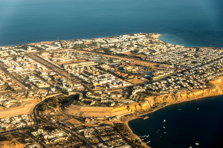 Top view of part of the island with buildings, hotels among the blue sea. Horizontal frameの写真素材
