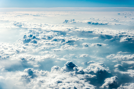Top view of white clouds above the ground or water. Horizontal frameの写真素材