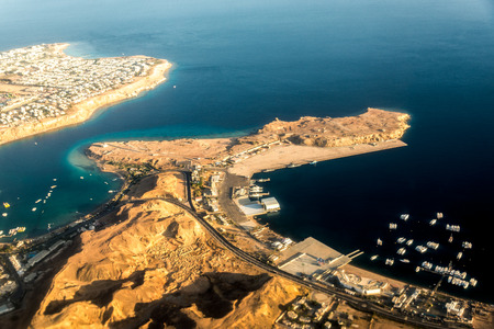 Top view of part of the island with buildings, hotels among the blue sea. Horizontal frameの写真素材