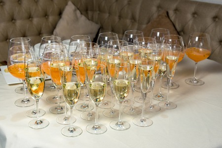 many glasses of champagne are on the tableの写真素材