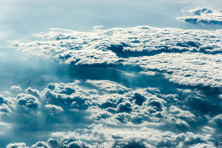 Top view of white clouds above the ground or water. Horizontal frameの写真素材