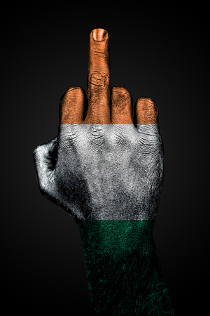 A hand with a painted flag of Ireland shows the middle finger, a sign of aggression, against a dark background. Vertical frame