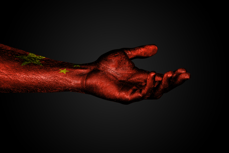 Outstretched hand with a drawn china flag, a sign of help or a request, on a dark background. Horizontal frameの写真素材