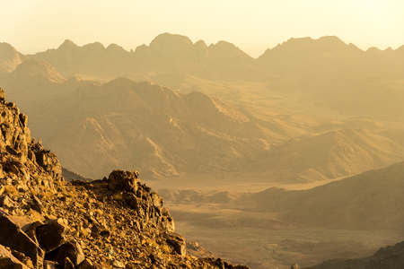 Middle East or Africa, picturesque bare mountain range and a large sandy valley desert landscapes landscape photography. Horizontal frameの写真素材
