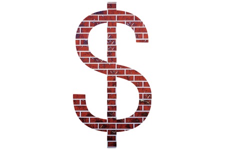 Red brick dollar sign on a white isolated background.の写真素材