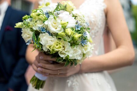 bouquet in the hands of the bride