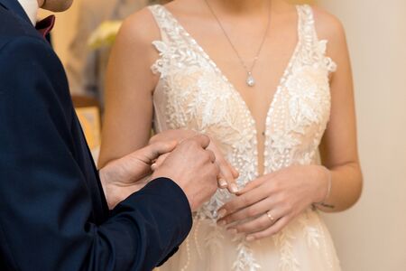 Bust of the bride in a white wedding dress, close-up.の写真素材