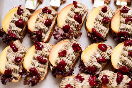 a lot of sandwiches with cherries on the whole frameの写真素材