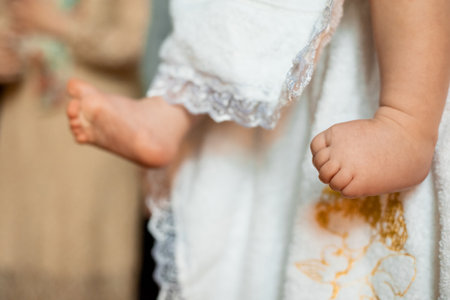 New Born Baby Feet on White Blanketの写真素材