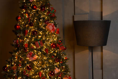 new year cozy home interior with christmas tree and garlandsの写真素材