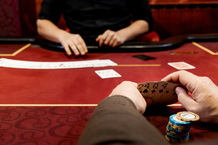 side view of men and women playing poker in a casinoの写真素材