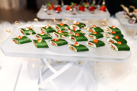 a lot of green sushi on a glass standの写真素材